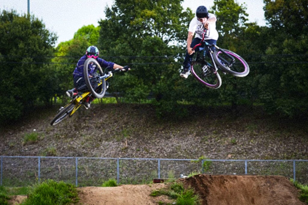 riding dirt jumps on mountain bike in japan