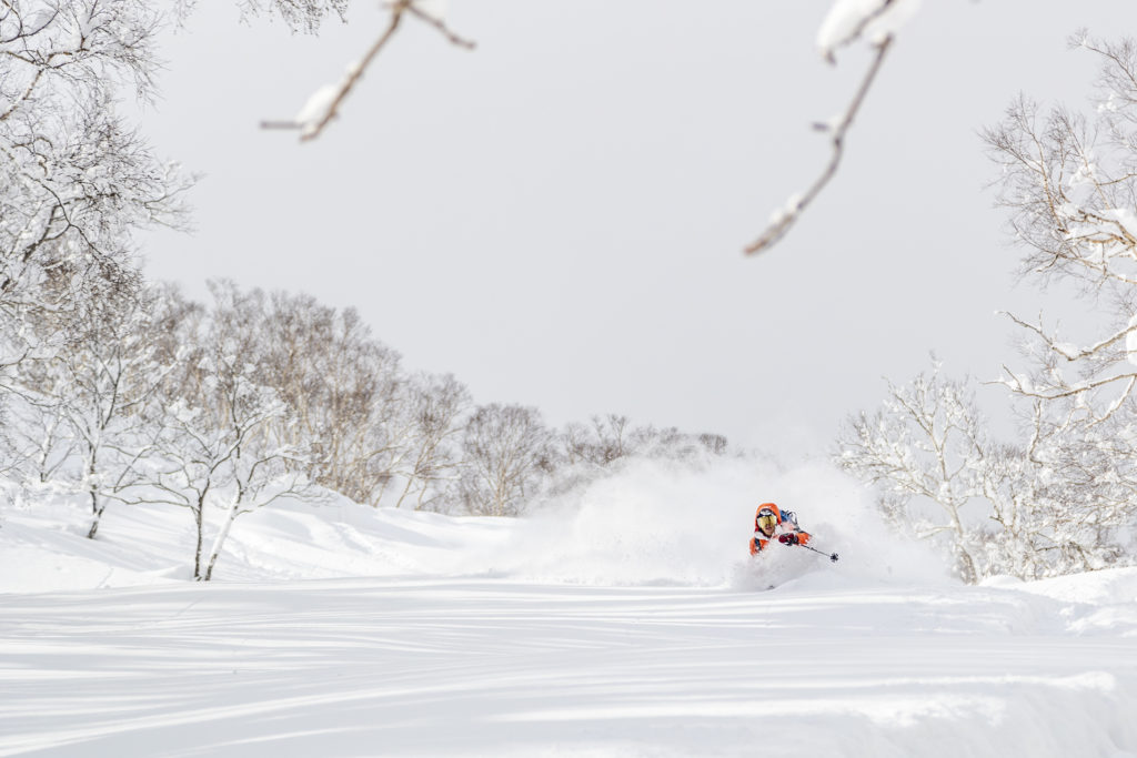 skier enjoying a deep powder run 